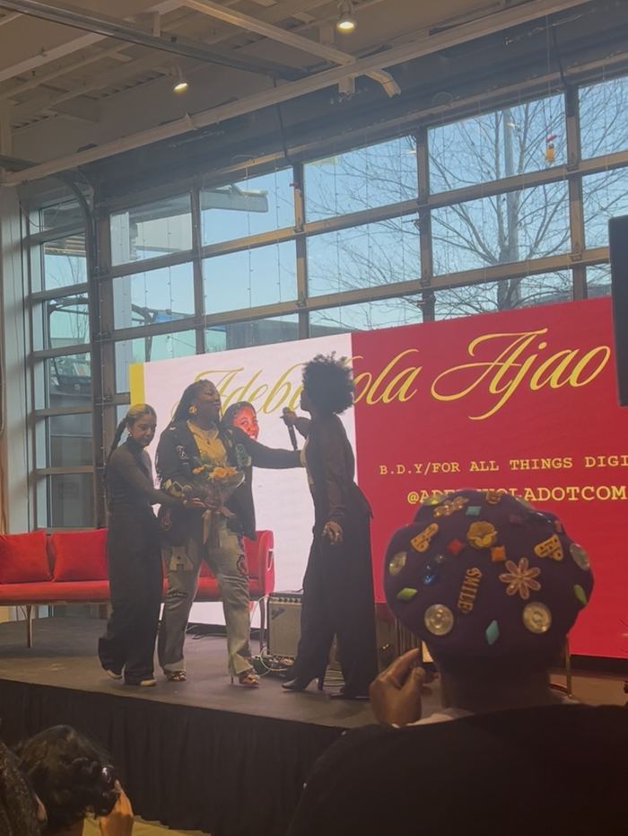 Adebukola Ajao being honored on stage at a community event