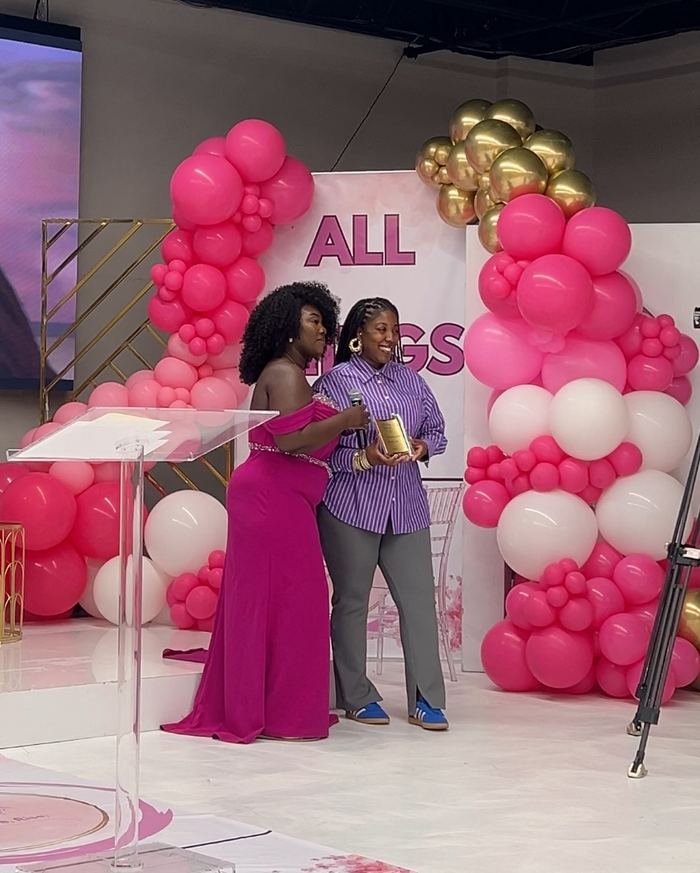Adebukola Ajao receiving the All Things Her trailblazing award on stage