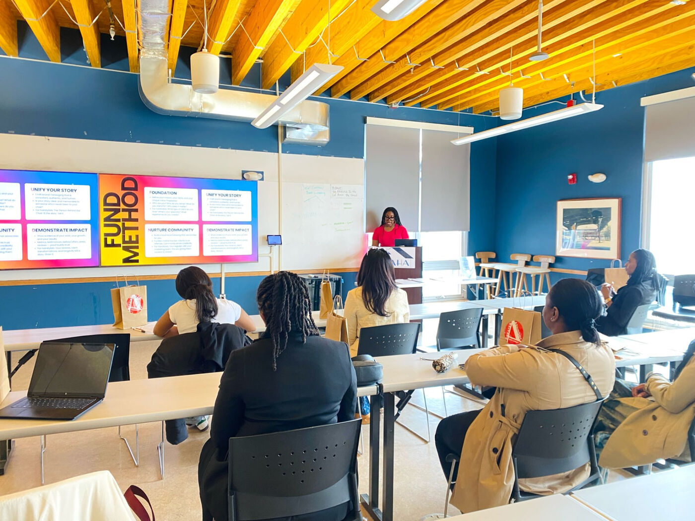 Adebukola Ajao teaching the Fund Method to a seated workshop room