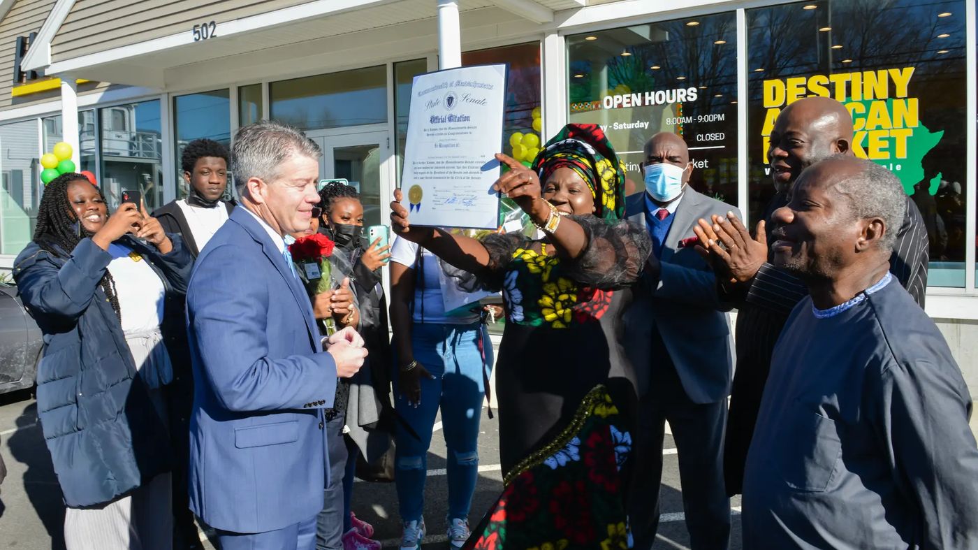 The Massachusetts State Senate citation presented to Destiny African Market outside the store