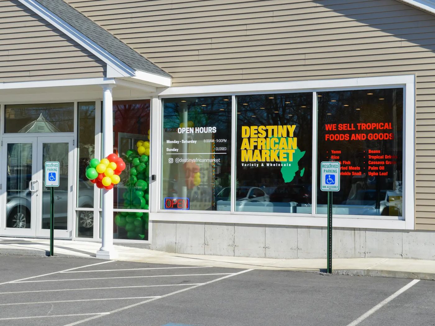The Destiny African Market storefront with balloons at the entrance and tropical foods signage in the windows